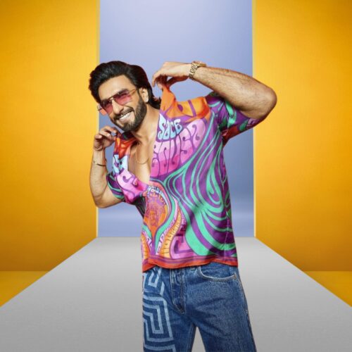 Bollywood actor in Ranveer Singh inspired fashion pose wearing vibrant outfit