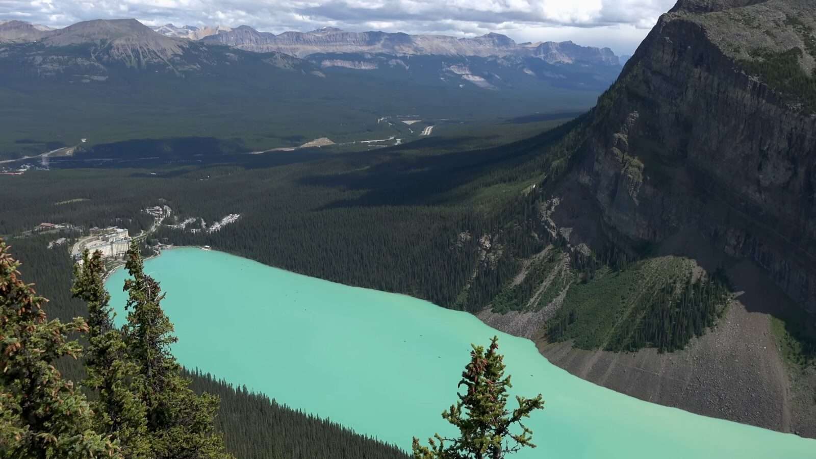 Beautiful picture of a range of mountains with trees near a lake, Wonders of the World Pictures.
