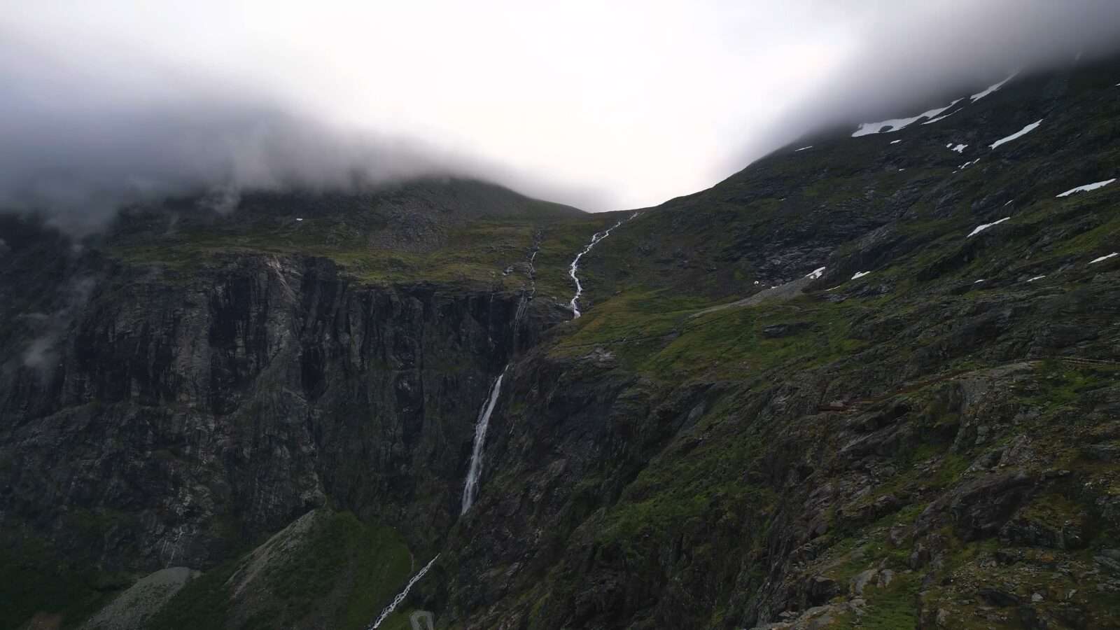 A waterfall flowing in the mountains, presenting a wonderful view of natural beauty, Wonders of the World Pictures.
