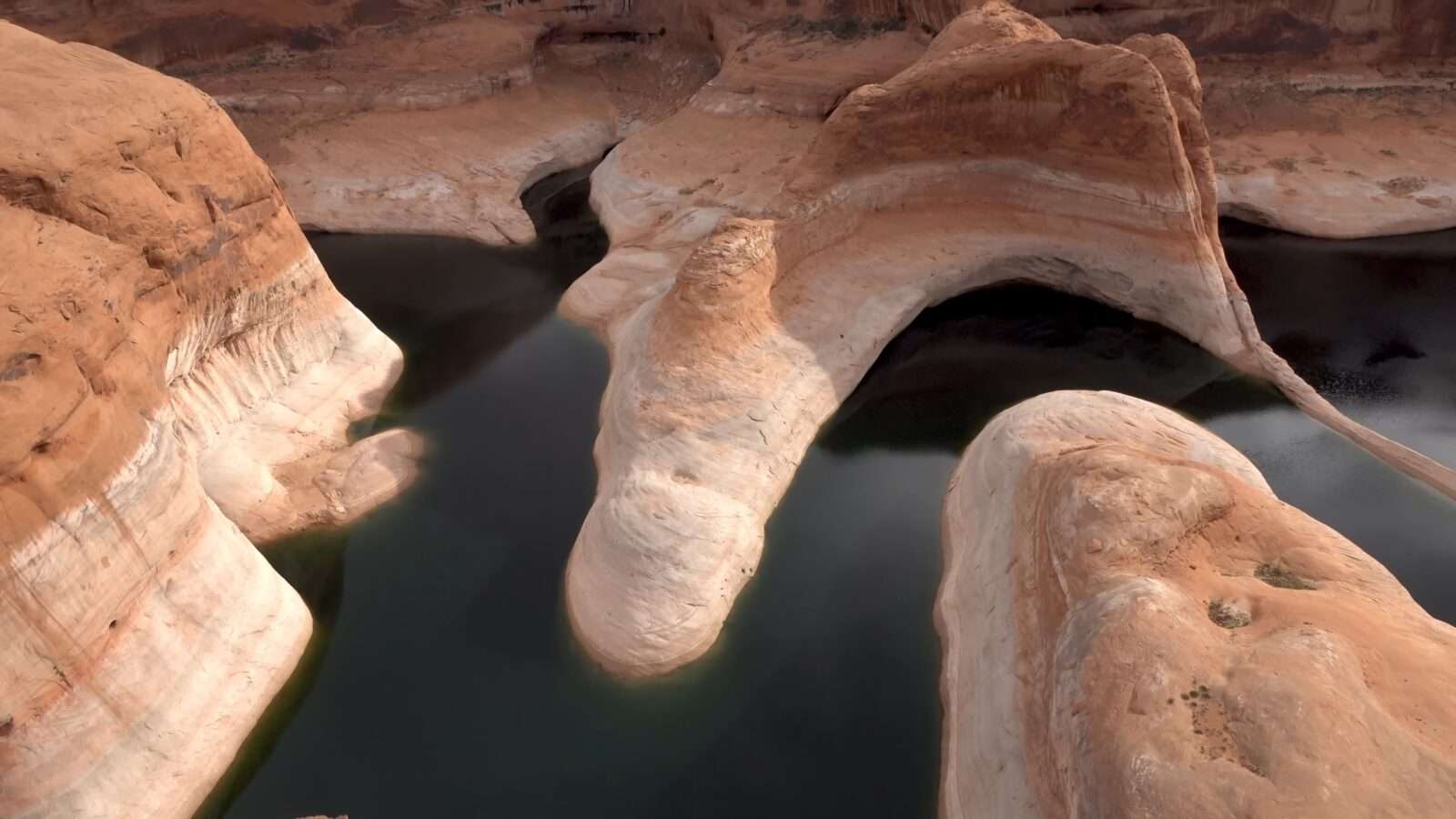 A huge reservoir, surrounded by rocky formations, presents a wonderful example of natural beauty, Wonders of the World Pictures.
