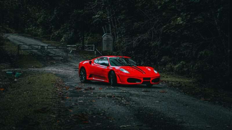 The red Ferrari is parked in a scary spot.