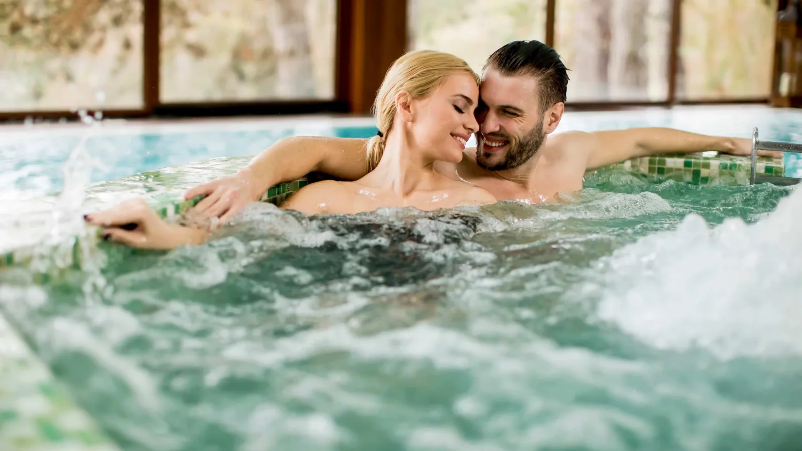 A man and woman spending time together in a hot tub