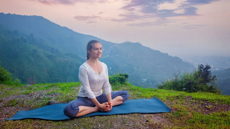 Woman Doing Yoga Asana Baddha Konasana Outdoors