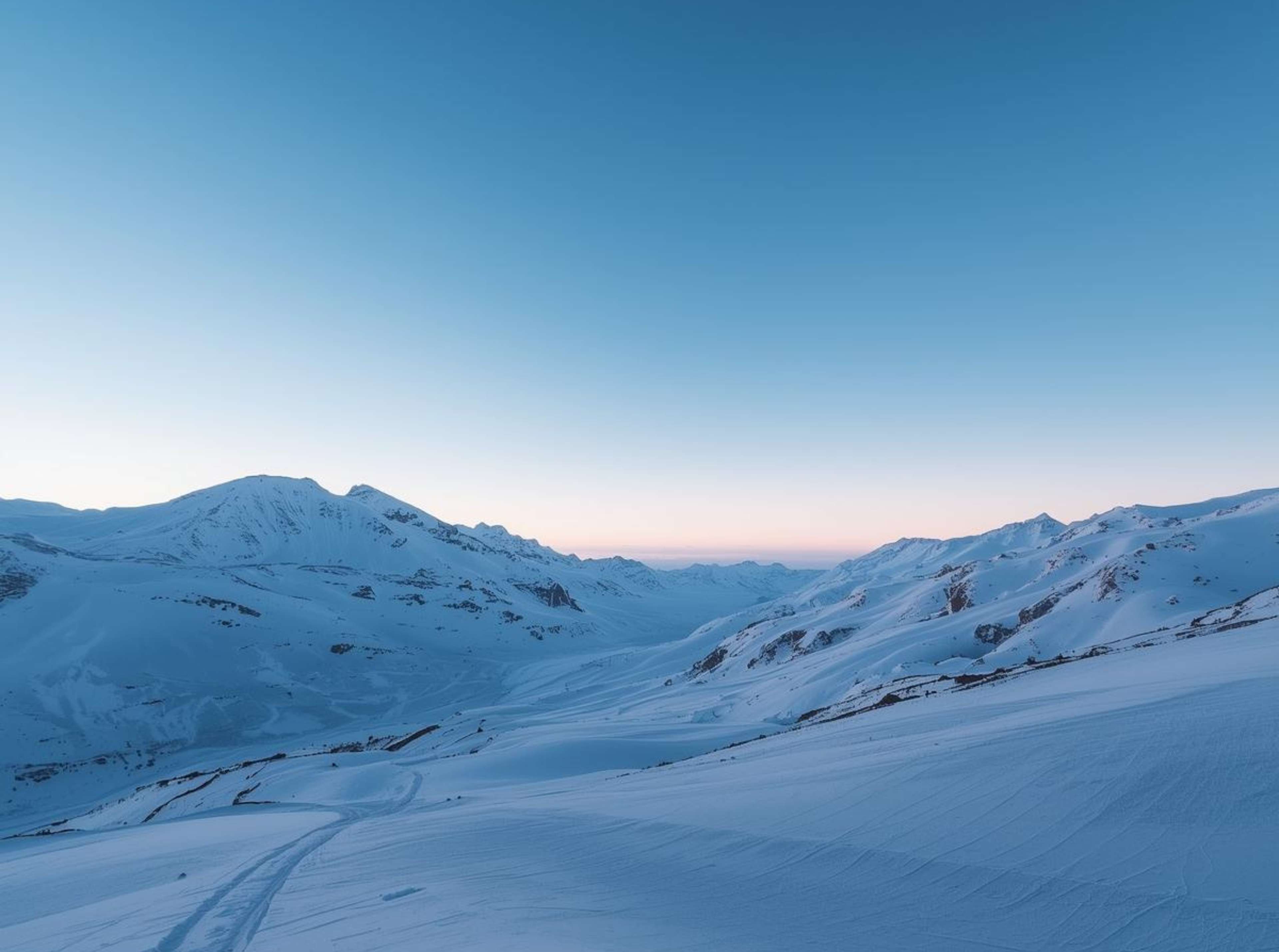 Free 4K image of snowy winter mountains under clear sky.