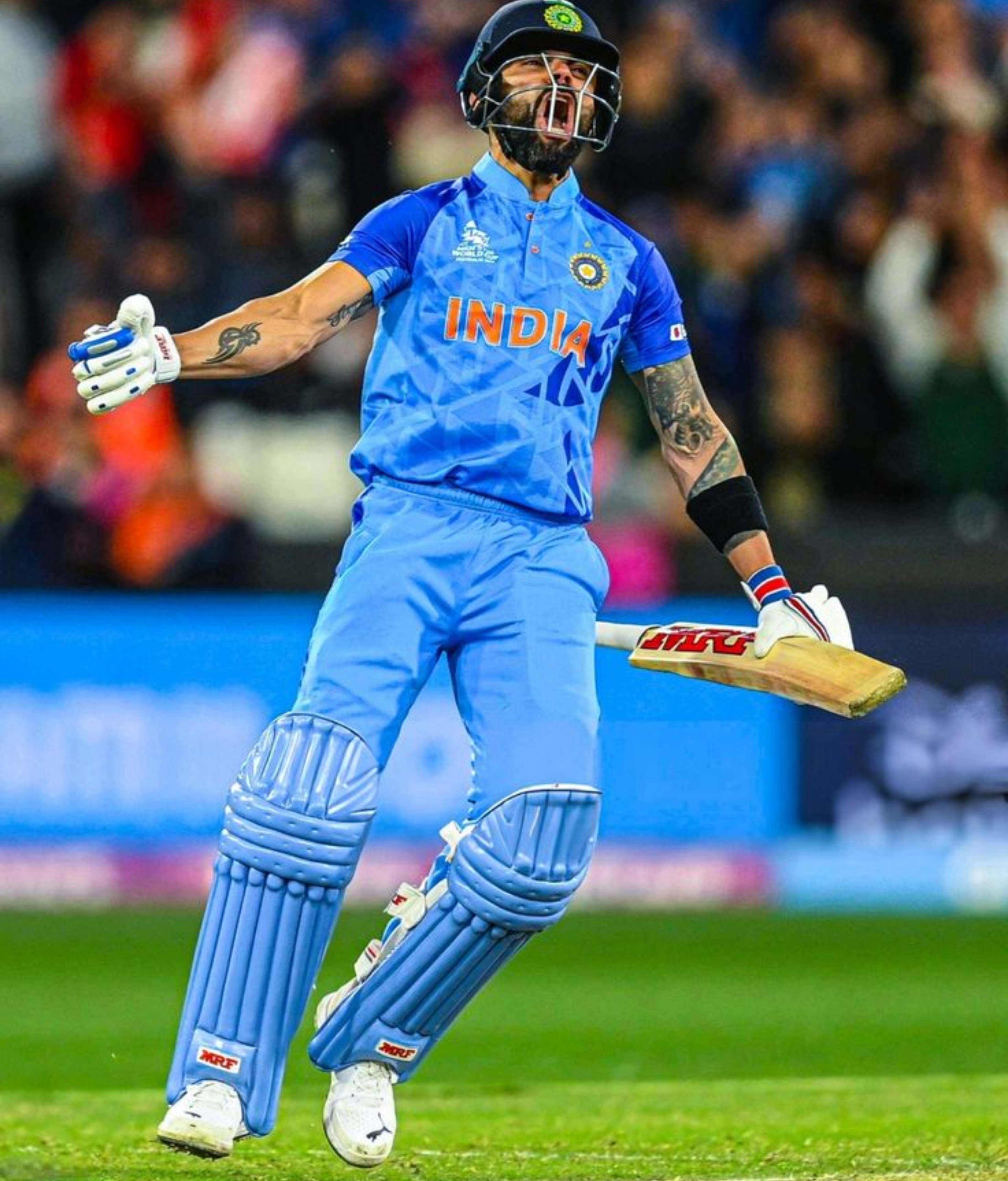 Virat Kohli celebrating passionately on the cricket field in blue India jersey – 4K action wallpaper