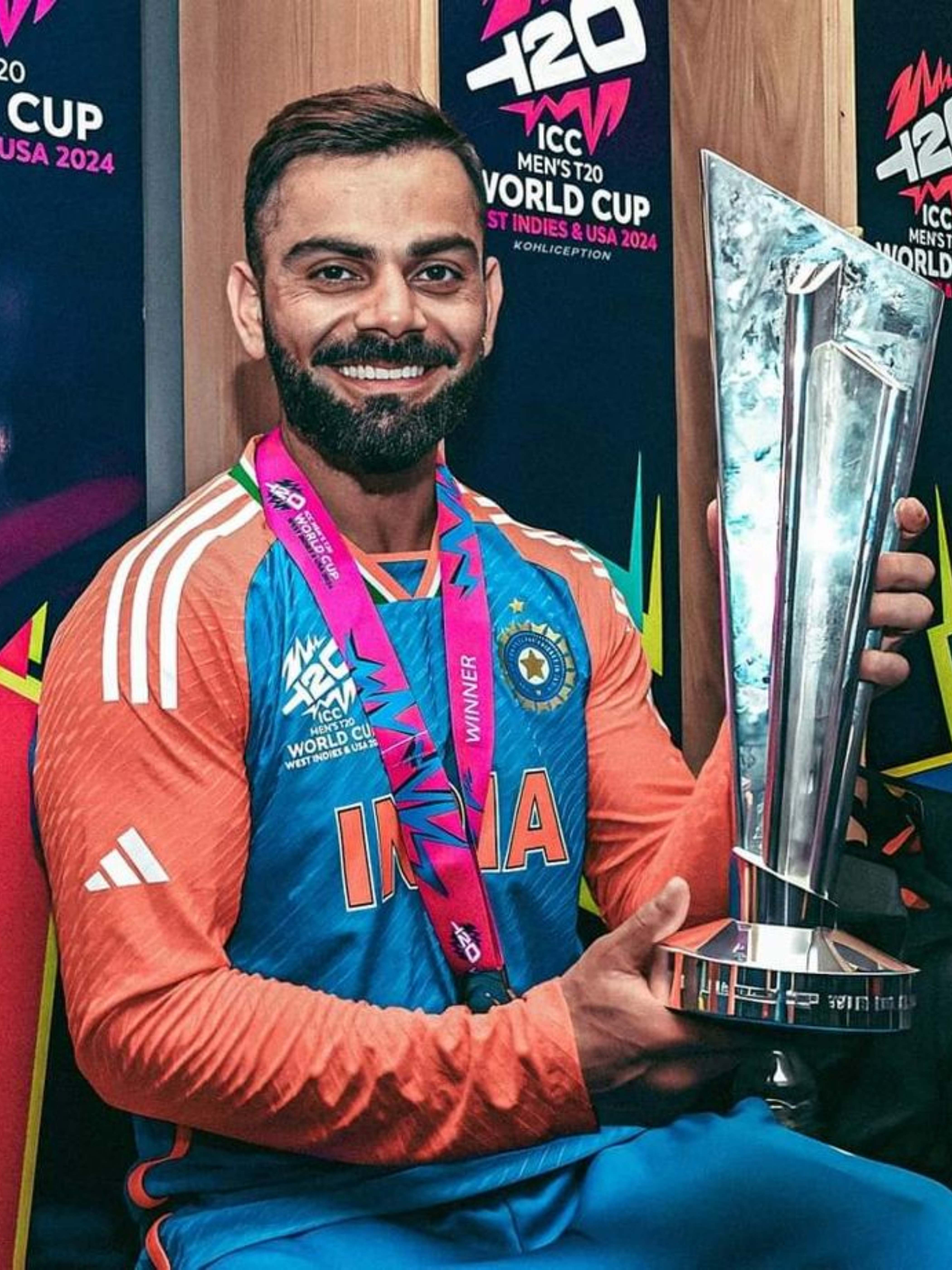 Virat Kohli holding the ICC T20 World Cup 2024 trophy with a winning smile – 4K HD wallpaper