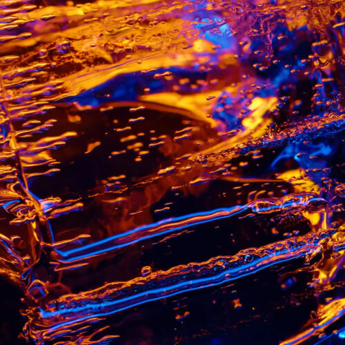 Neon crystal texture abstract 4K wallpaper with glowing orange and purple light