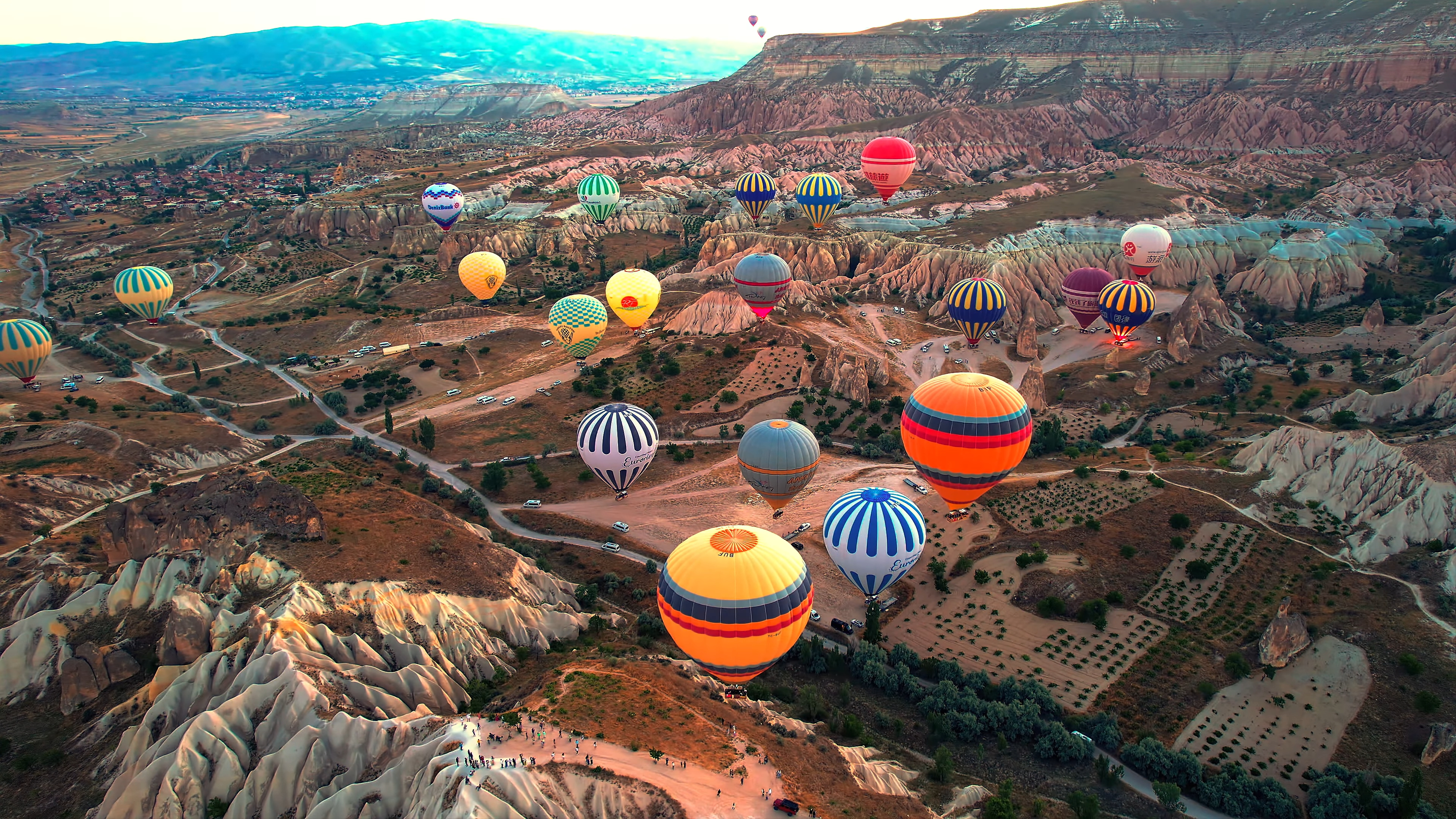 Color Wallpaper 4K hot air balloons over colorful valley landscape