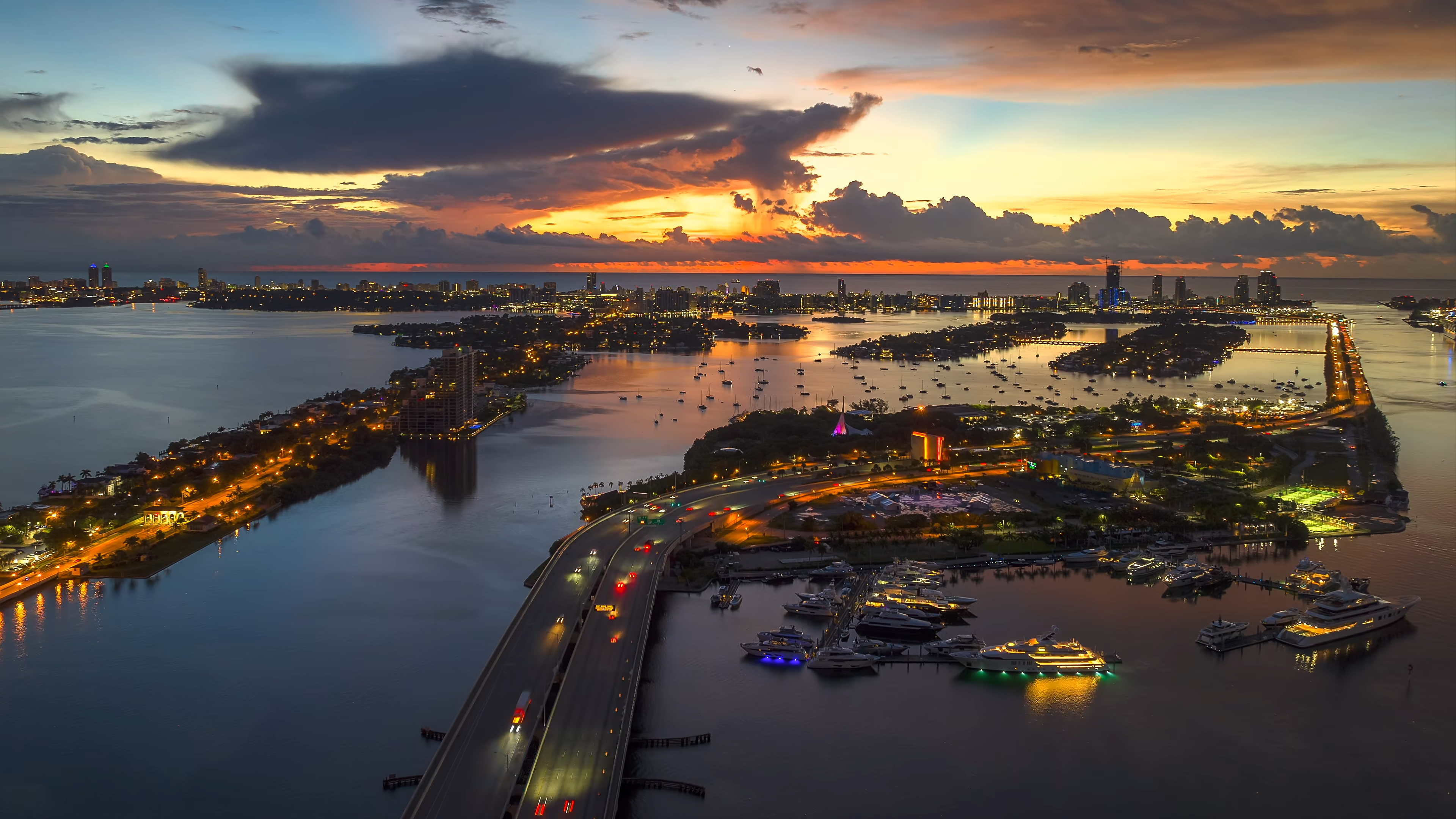Color Wallpaper 4K sunset cityscape with harbor and lights