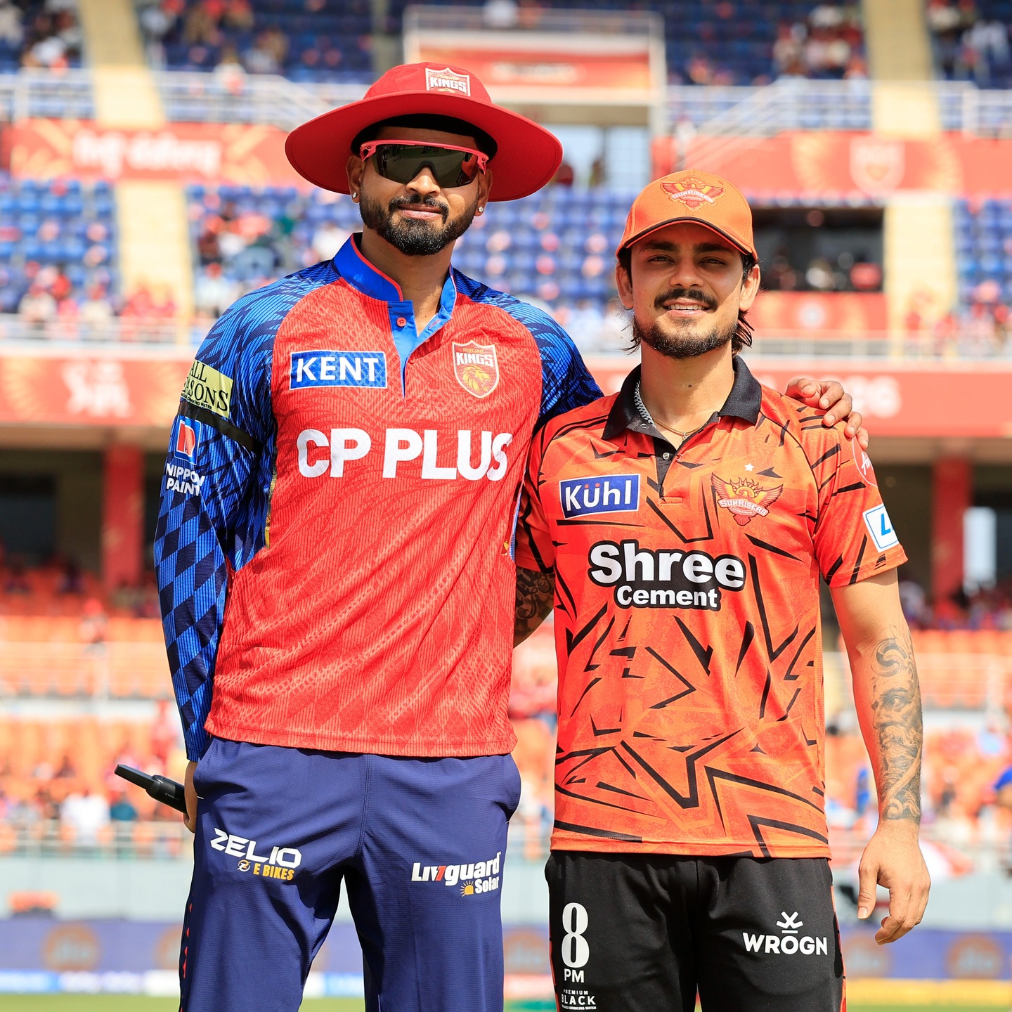 IPL team captains posing together before match in stadium
