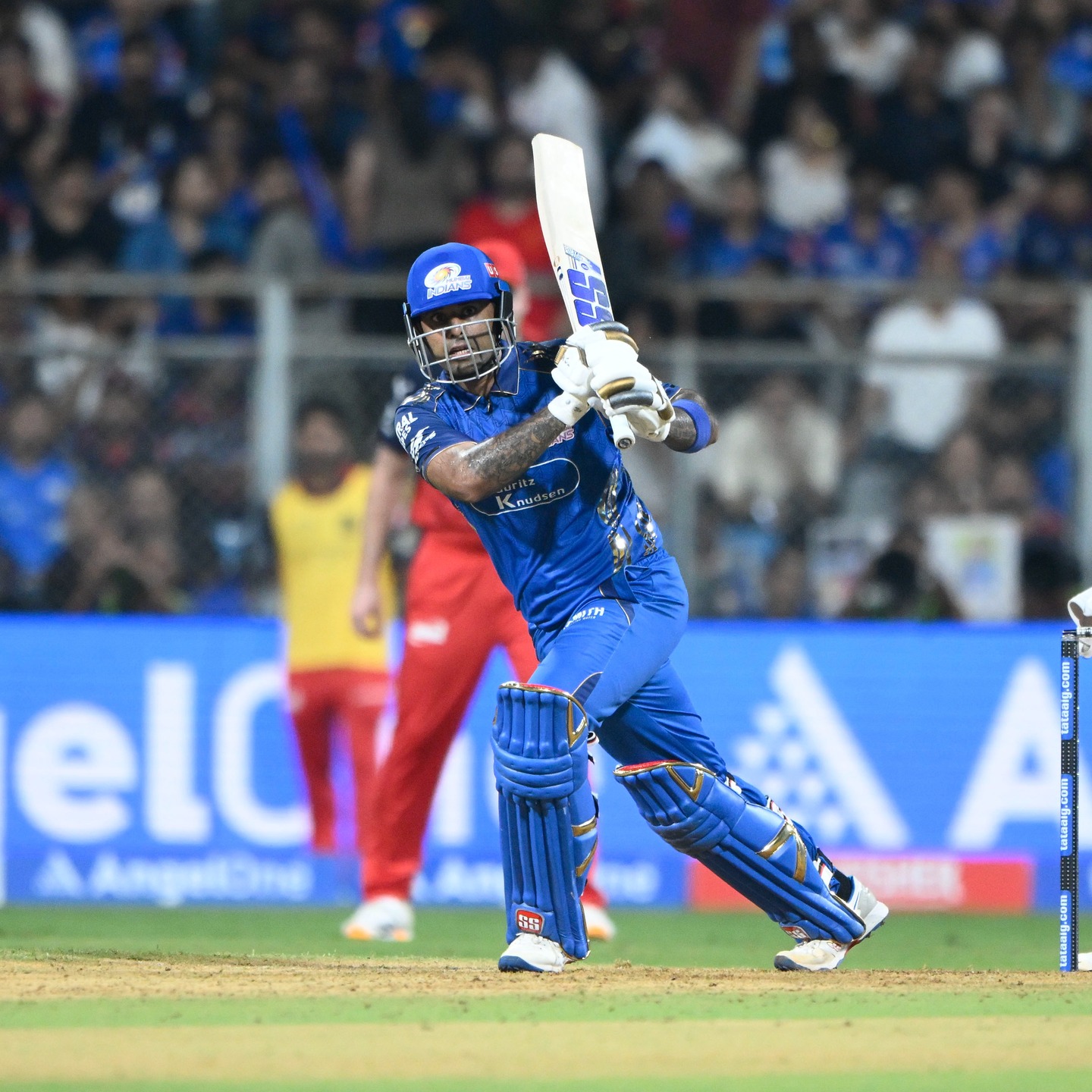 Surya Kumar YadavMumbai Indians batsman playing a cover drive shot in IPL match