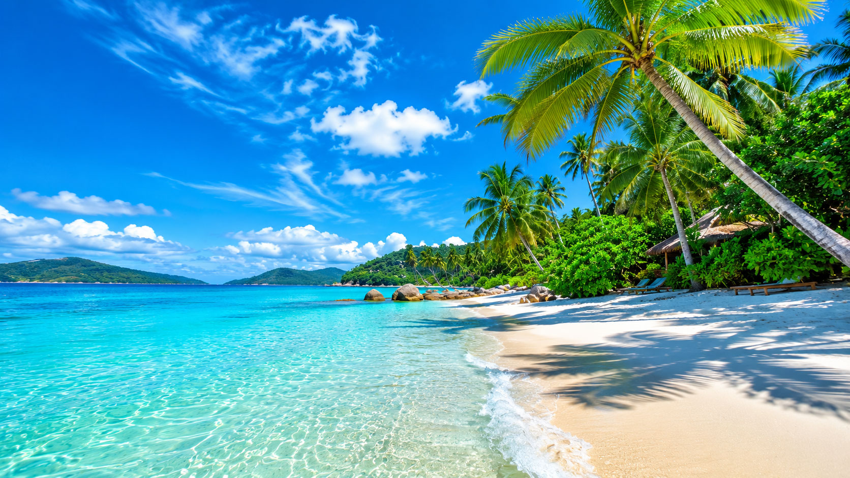 Beautiful tropical beach with turquoise water and palm trees under a blue sky.